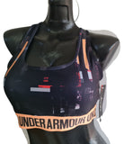Under Armour top deportivo impacto medio